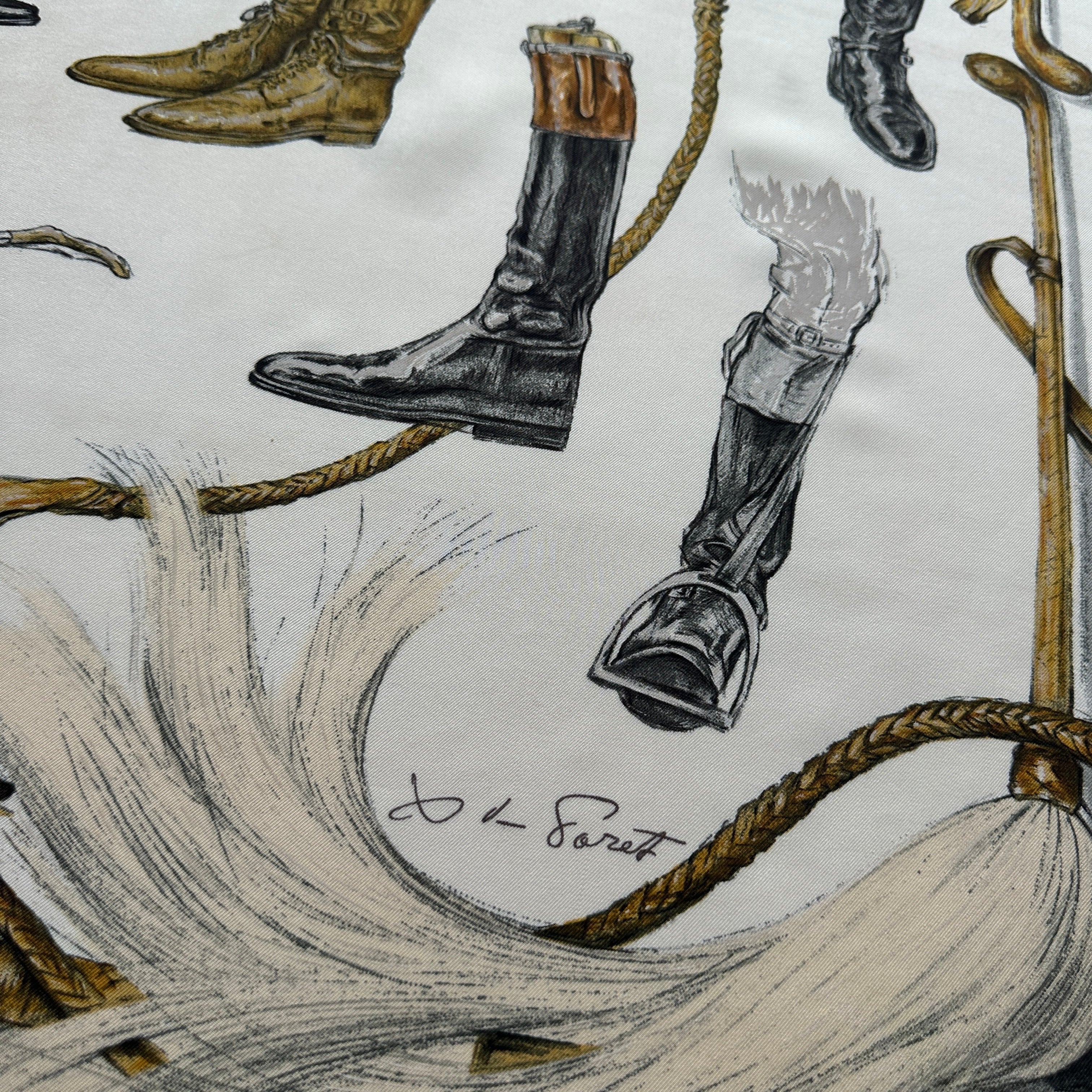 Signature de l'artiste "X. de Poret" en bas à droite, à côté d'étriers et de poils de chevaux stylisés.